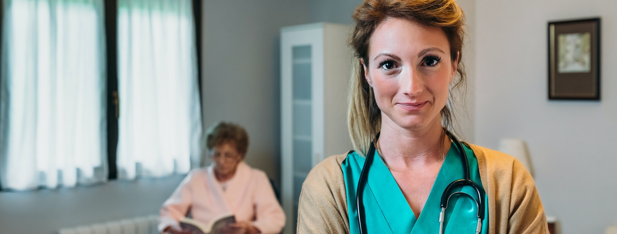 Pretty female doctor posing in a geriatric clinic